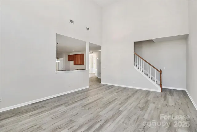 a view of an entryway with wooden floor