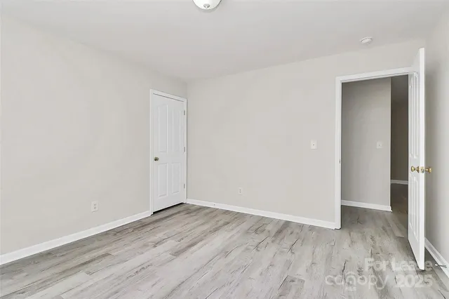 a view of room with wooden floor