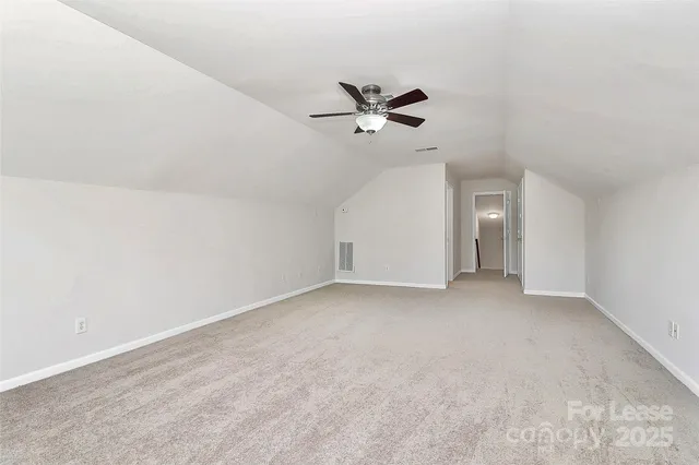 a view of a big room with carpet