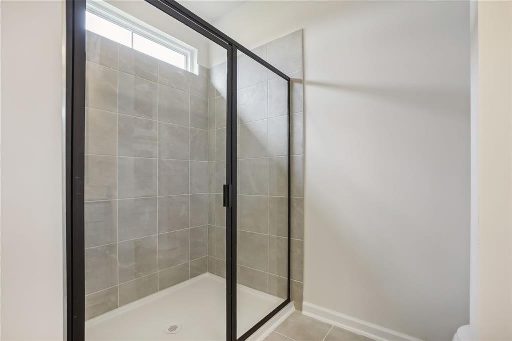 10 Southbend Court Rome, GA 30165 - Photo 22 of 25 a bathroom with a glass shower door