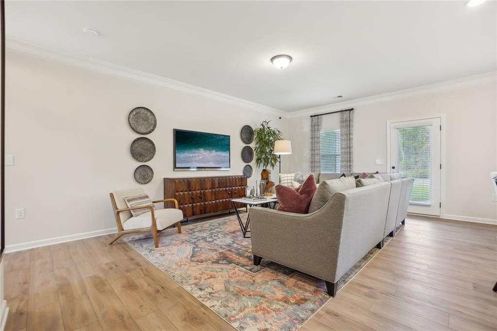 10 Southbend Court Rome, GA 30165 - Photo 4 of 25 a living room with furniture and a flat screen tv