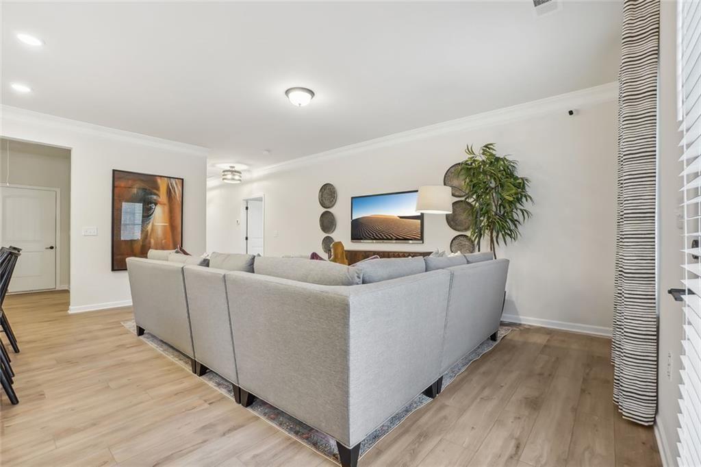 10 Southbend Court Rome, GA 30165 - Photo 6 of 25 a living room with furniture and a flat screen tv