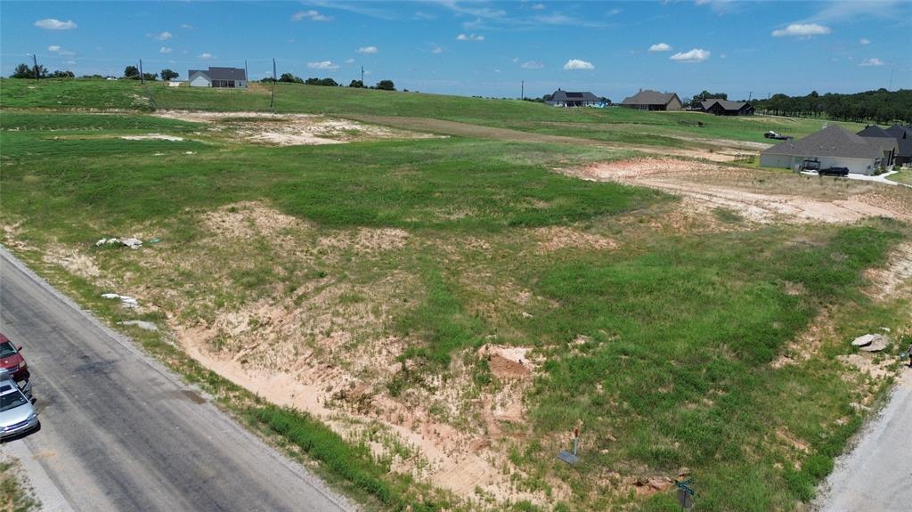 3001 Westfork Way Springtown, TX 76082 - Photo 2 of 7 a view of a golf course with a garden