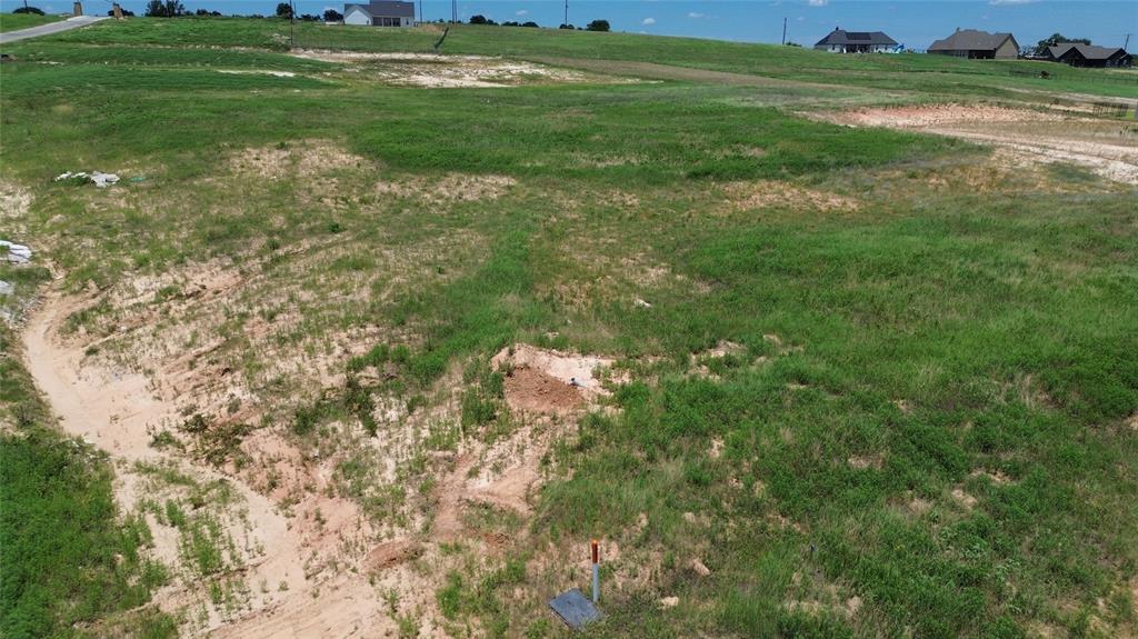 3001 Westfork Way Springtown, TX 76082 - Photo 7 of 7 a backyard of a house with lots of green space and mountain view in back