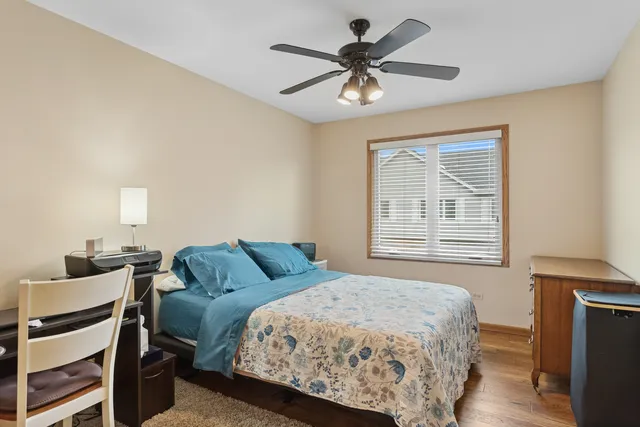 a bedroom with a bed furniture and a window