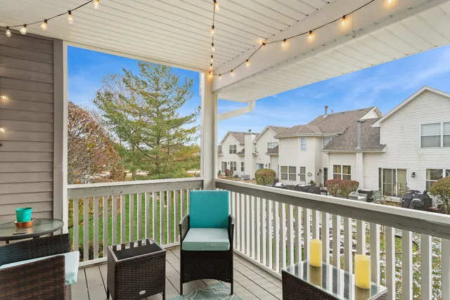 a view of a balcony with furniture