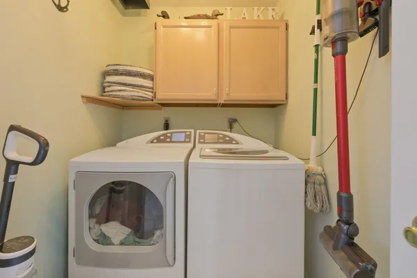 a view of a livingroom with furniture and a potted plant