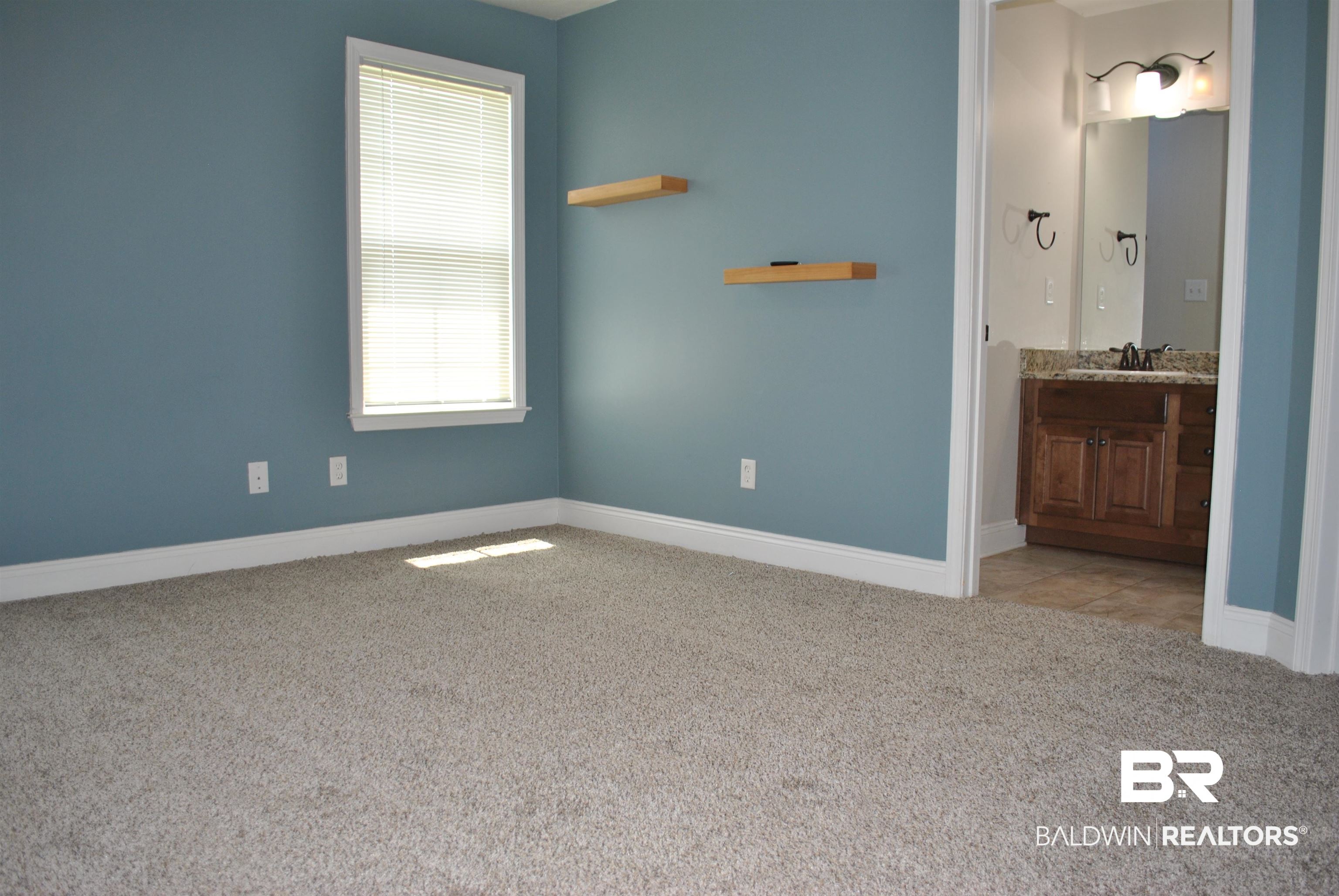 2161 Spring Grove West Mobile, AL 36695 - Photo 18 of 31 Unfurnished bedroom with carpet floors and ensuite bath