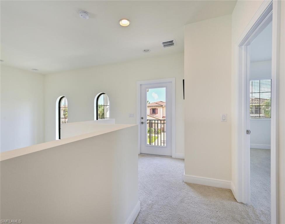 1326 Kendari Terrace Naples, FL 34113 - Photo 15 of 37 a view of room with window and stairs