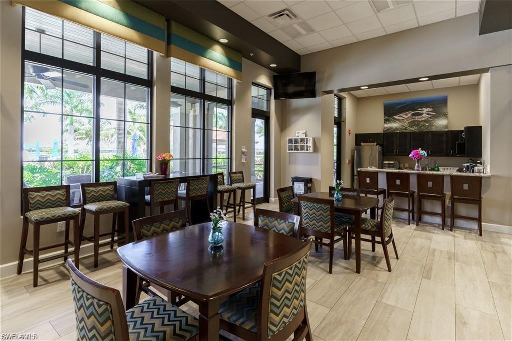 1326 Kendari Terrace Naples, FL 34113 - Photo 27 of 37 a view of a dining room with furniture window and outside view