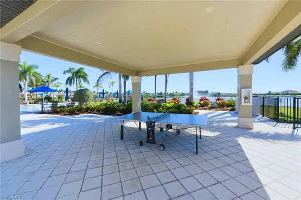a view of a swimming pool with a patio