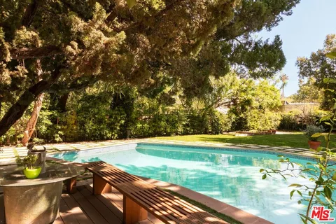a view of a yard with an outdoor space
