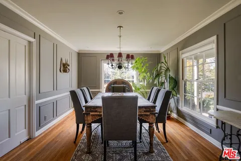 a dining room with furniture window wooden floor