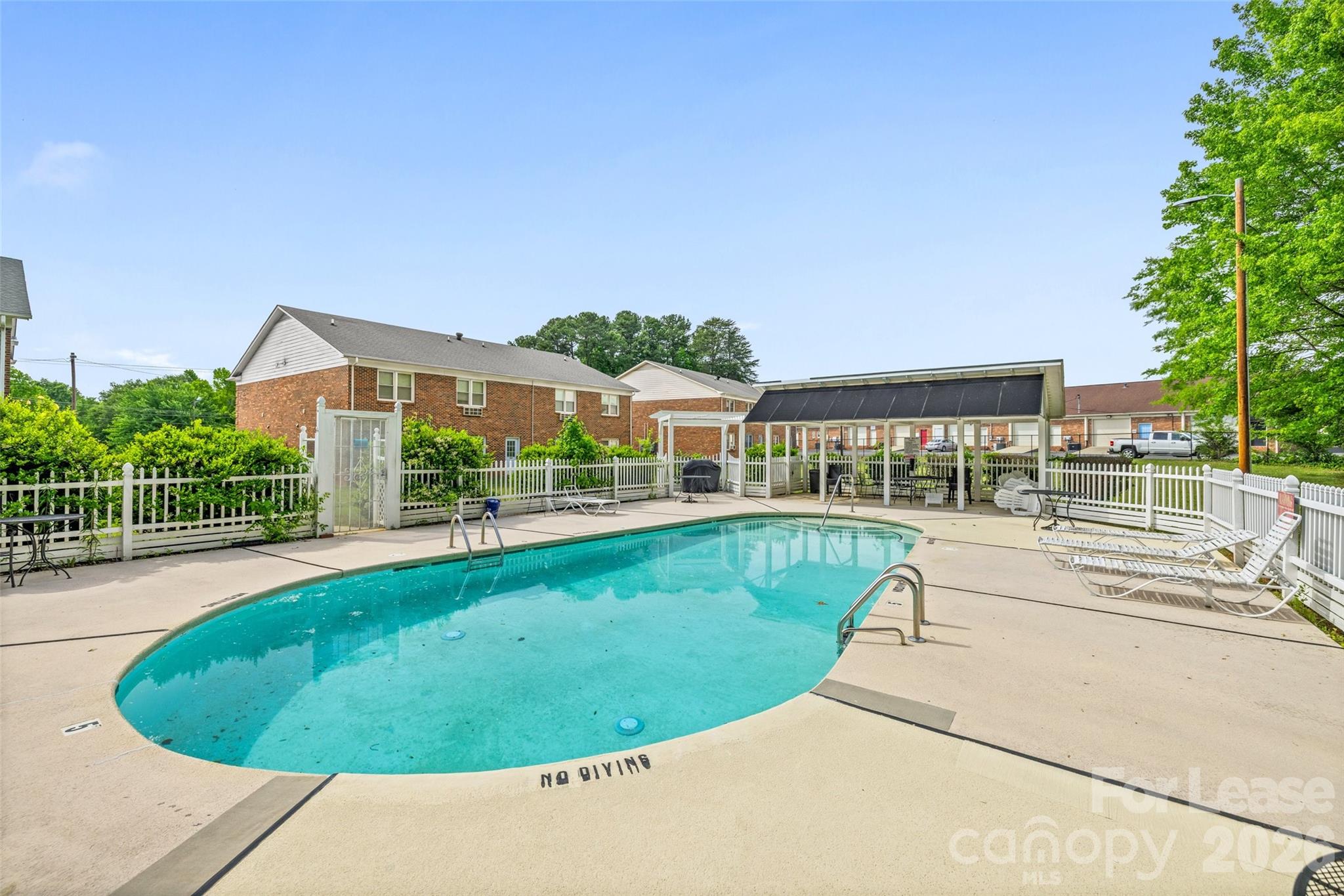 113 Stroupe Road, Unit E Gastonia, NC 28056 - Photo 31 of 33 a view of a swimming pool with a patio