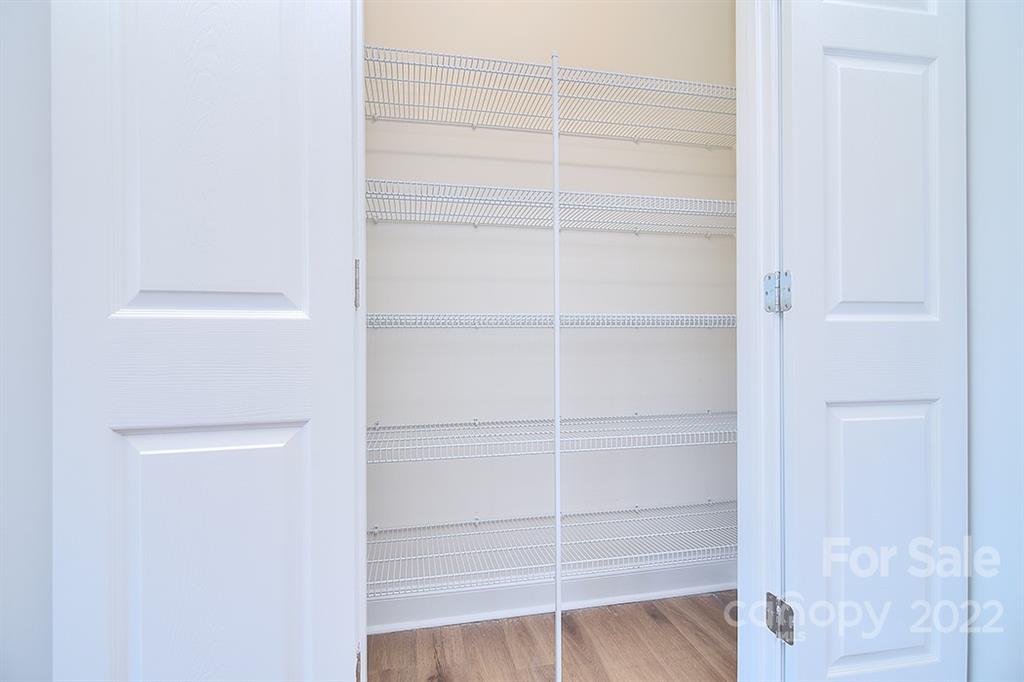 0 Pepperidge Lane Monroe, NC 28110 - Photo 16 of 28 a view of walk in closet with empty racks