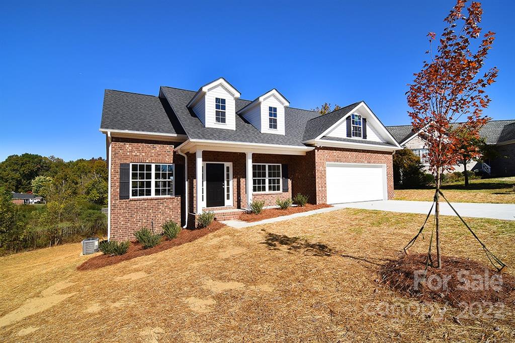 0 Pepperidge Lane Monroe, NC 28110 - Photo 3 of 28 a front view of a house with a yard and garage