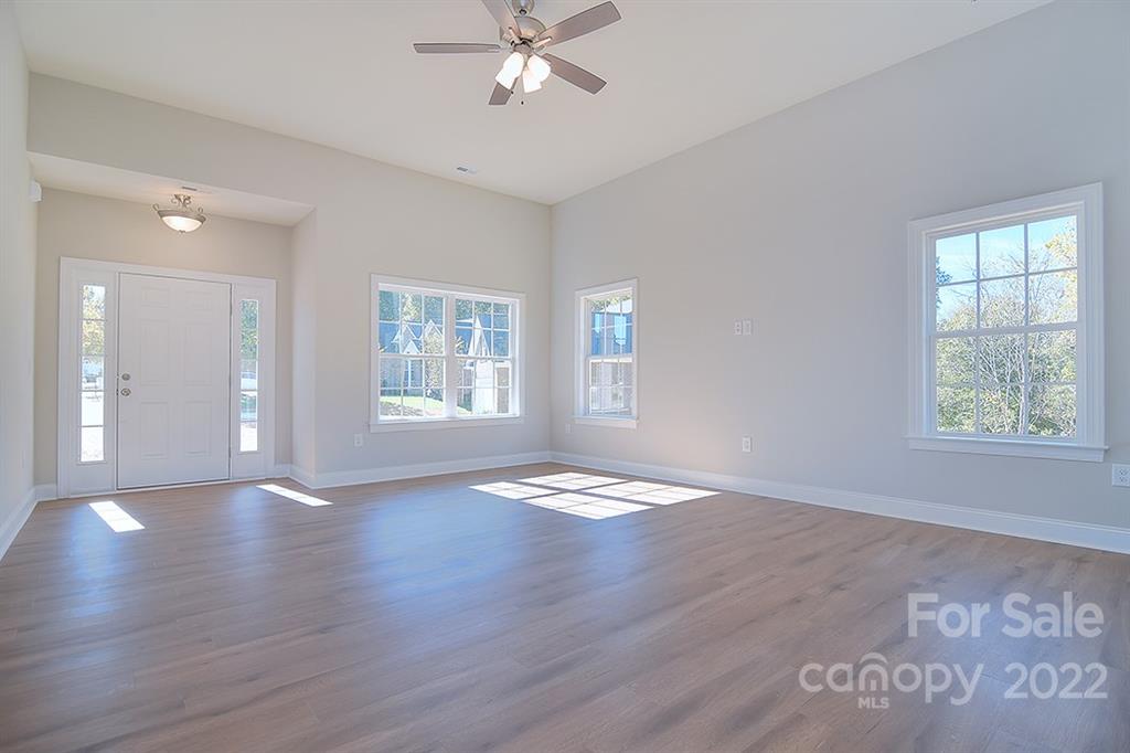 0 Pepperidge Lane Monroe, NC 28110 - Photo 8 of 28 a view of an empty room with wooden floor and a window