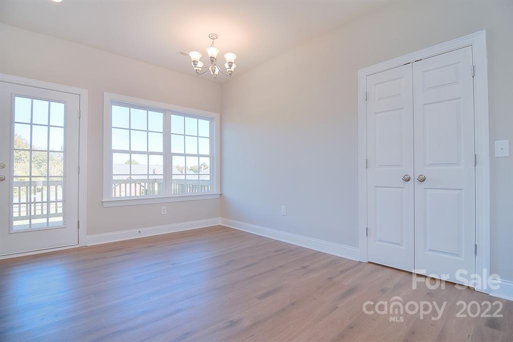 0 Pepperidge Lane Monroe, NC 28110 - Photo 9 of 28 a view of an empty room with a window and wooden floor