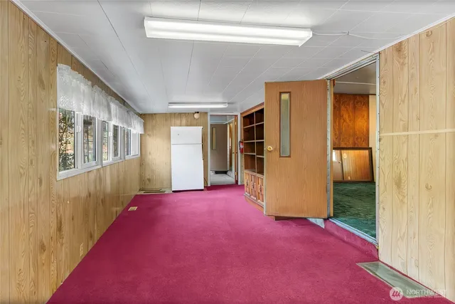 a view of an empty room with a window