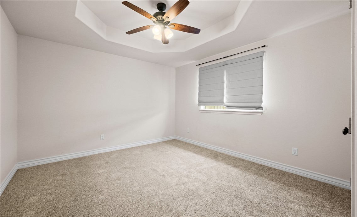 2517 Luzius Drive Corpus Christi, TX 78418 - Photo 21 of 25 an empty room with a window and a fan