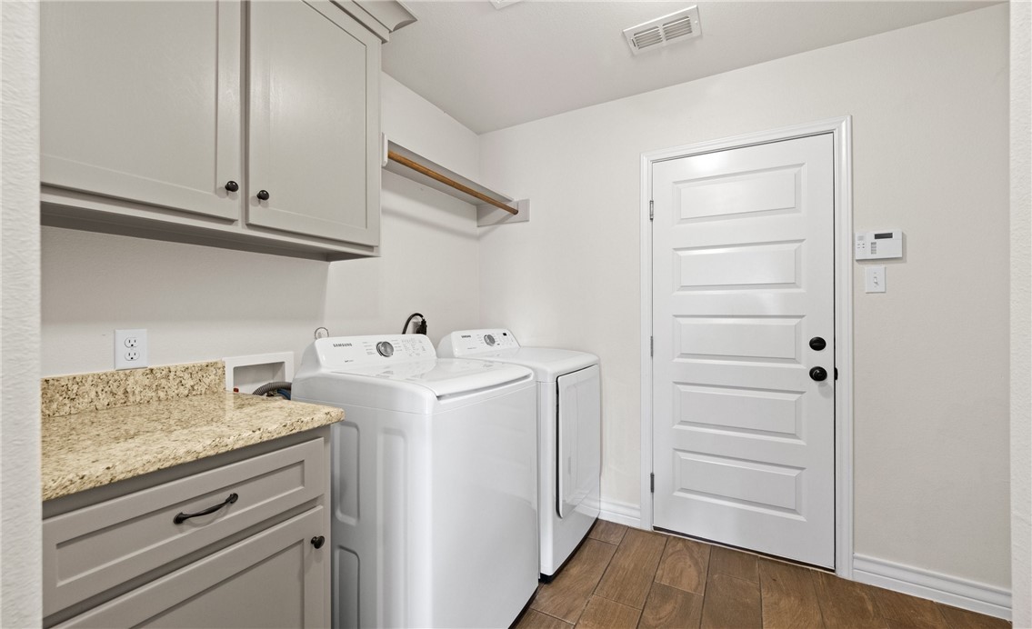 2517 Luzius Drive Corpus Christi, TX 78418 - Photo 23 of 25 a utility room with cabinets