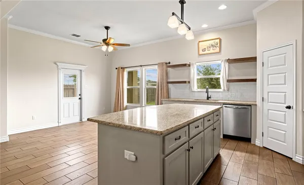 a kitchen with a table and chairs