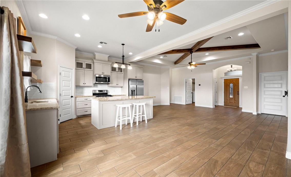 2517 Luzius Drive Corpus Christi, TX 78418 - Photo 10 of 25 a view of kitchen with cabinets and wooden floor