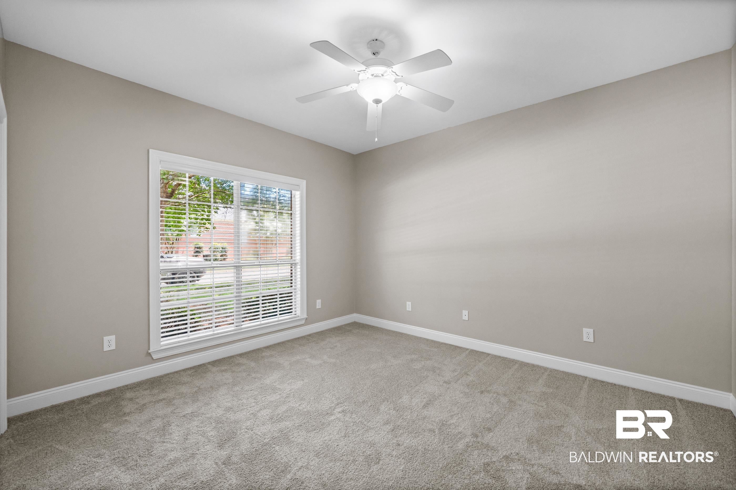 303 Savannah Circle Foley, AL 36535 - Photo 16 of 34 Room featuring neutral gray walls, plush gray carpeting, and white baseboards