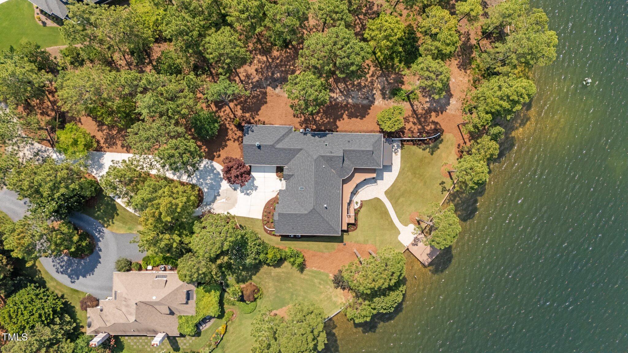 106 Mace Point West End, NC 27376 - Photo 7 of 79 an aerial view of a house with a yard and lake view