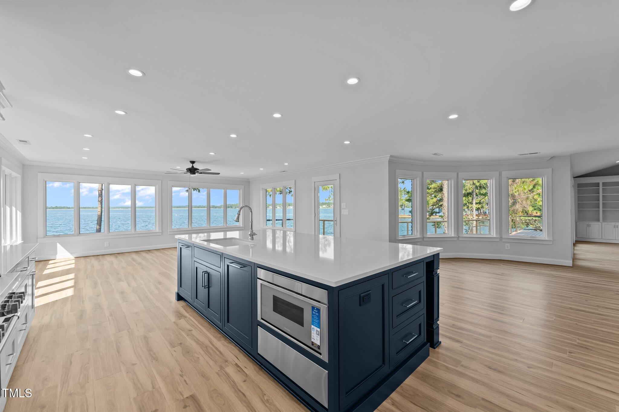 106 Mace Point West End, NC 27376 - Photo 19 of 79 a kitchen with stainless steel appliances granite countertop a lot of counter space and wooden floors