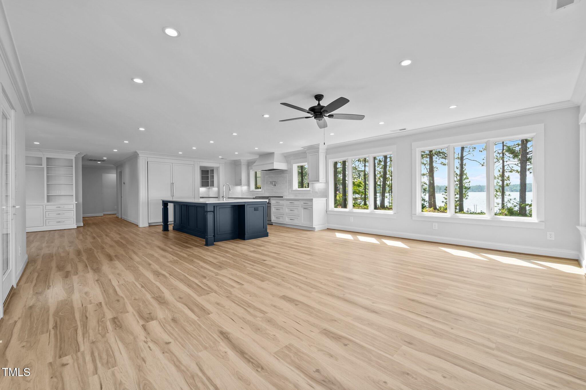 106 Mace Point West End, NC 27376 - Photo 23 of 79 a view of an empty room with a window and wooden floor