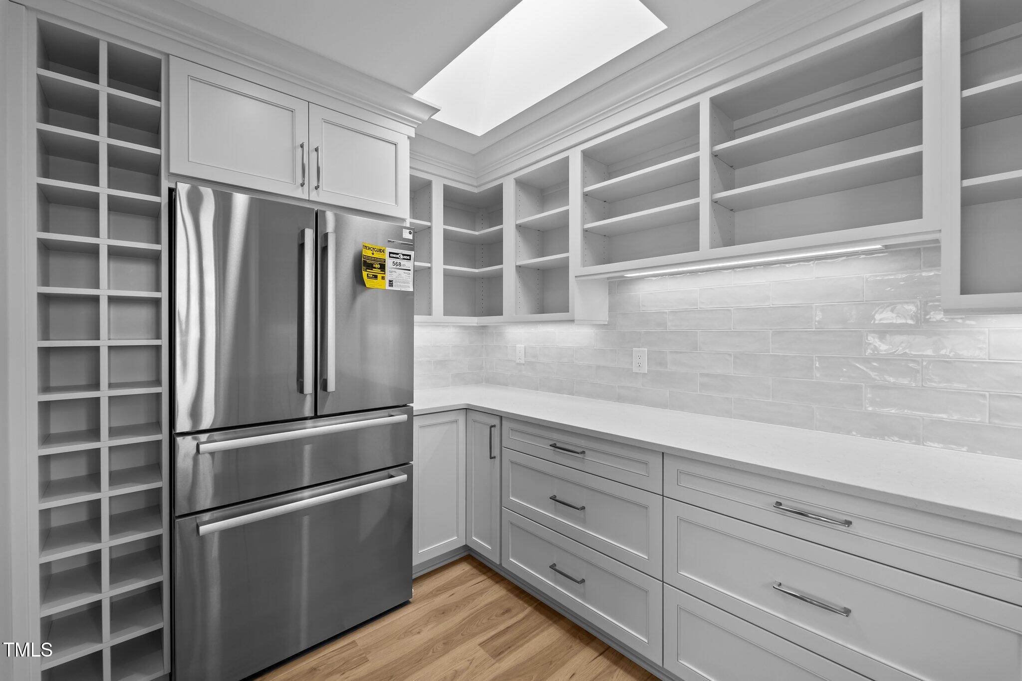 106 Mace Point West End, NC 27376 - Photo 26 of 79 a kitchen with cabinets and stainless steel appliances