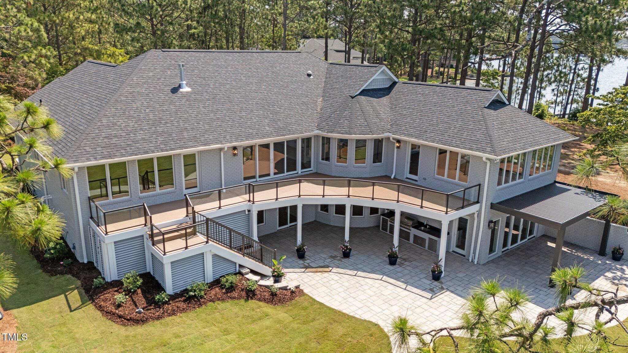 106 Mace Point West End, NC 27376 - Photo 2 of 79 a view of a house with pool and sitting area