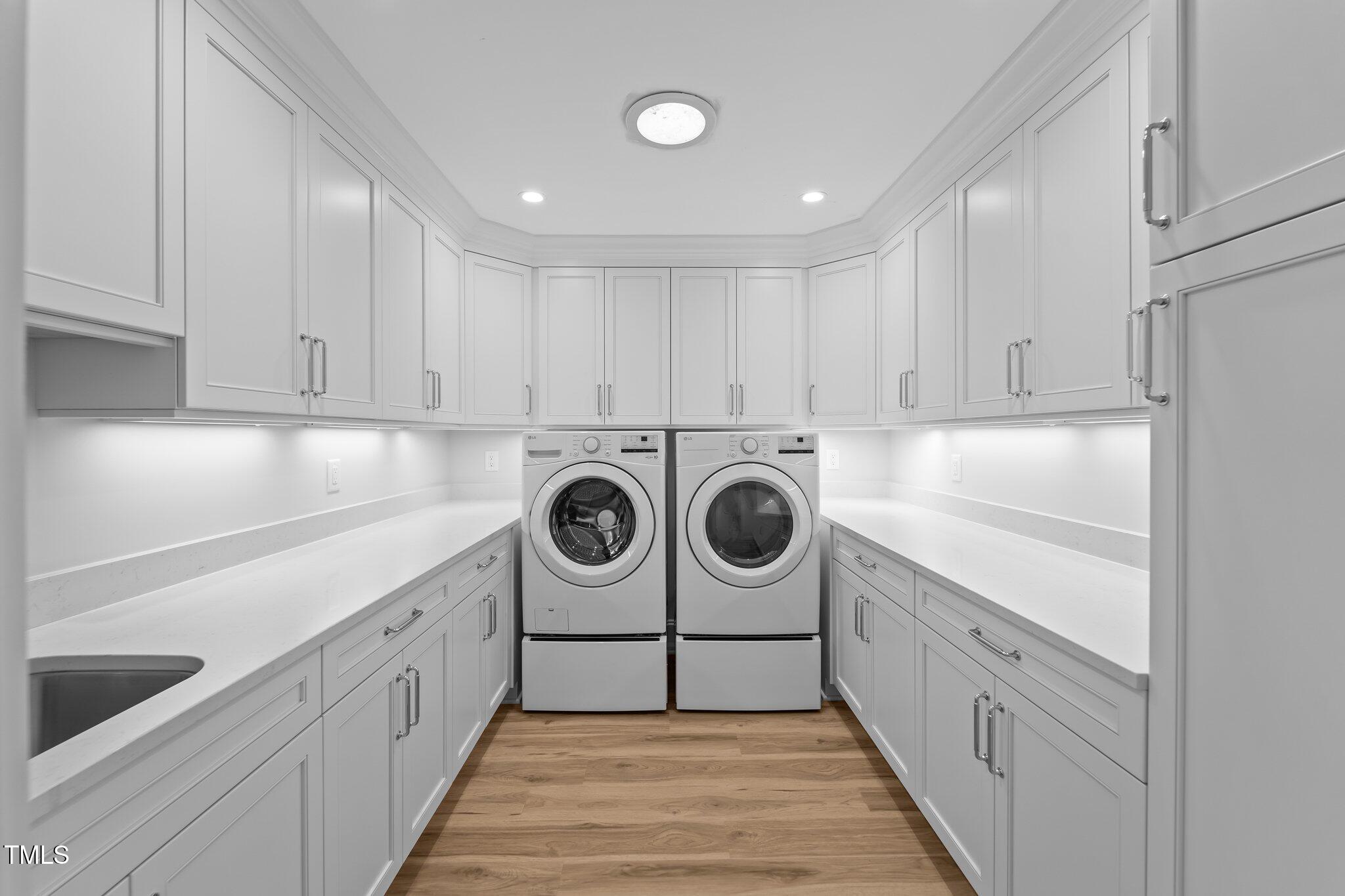 106 Mace Point West End, NC 27376 - Photo 27 of 79 a kitchen with a stove top oven sink and cabinets