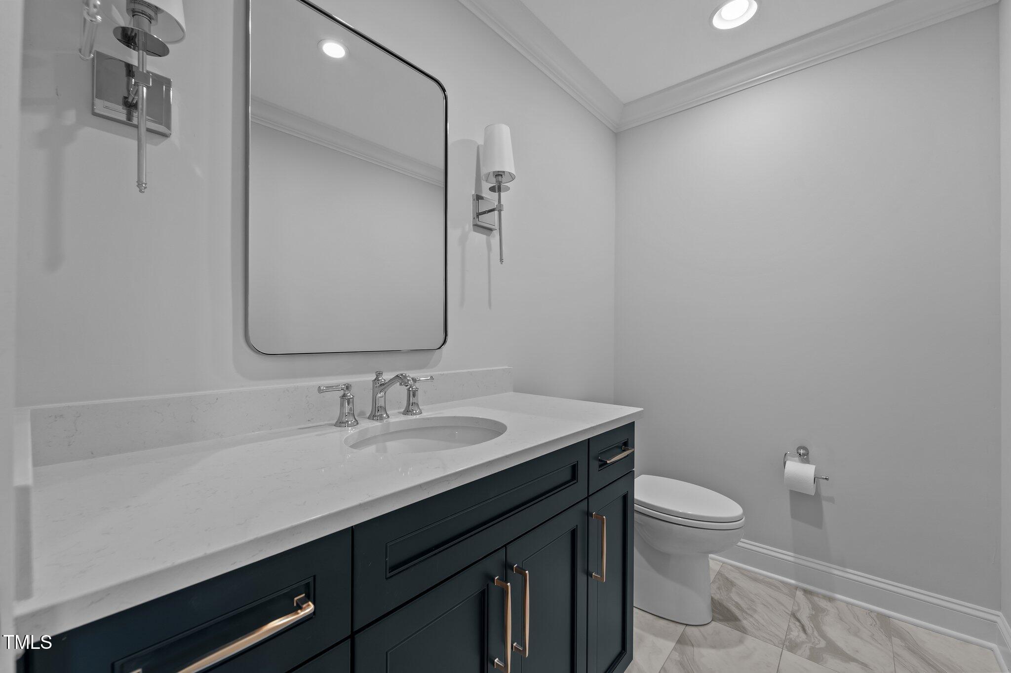106 Mace Point West End, NC 27376 - Photo 28 of 79 a bathroom with a sink a toilet and a mirror