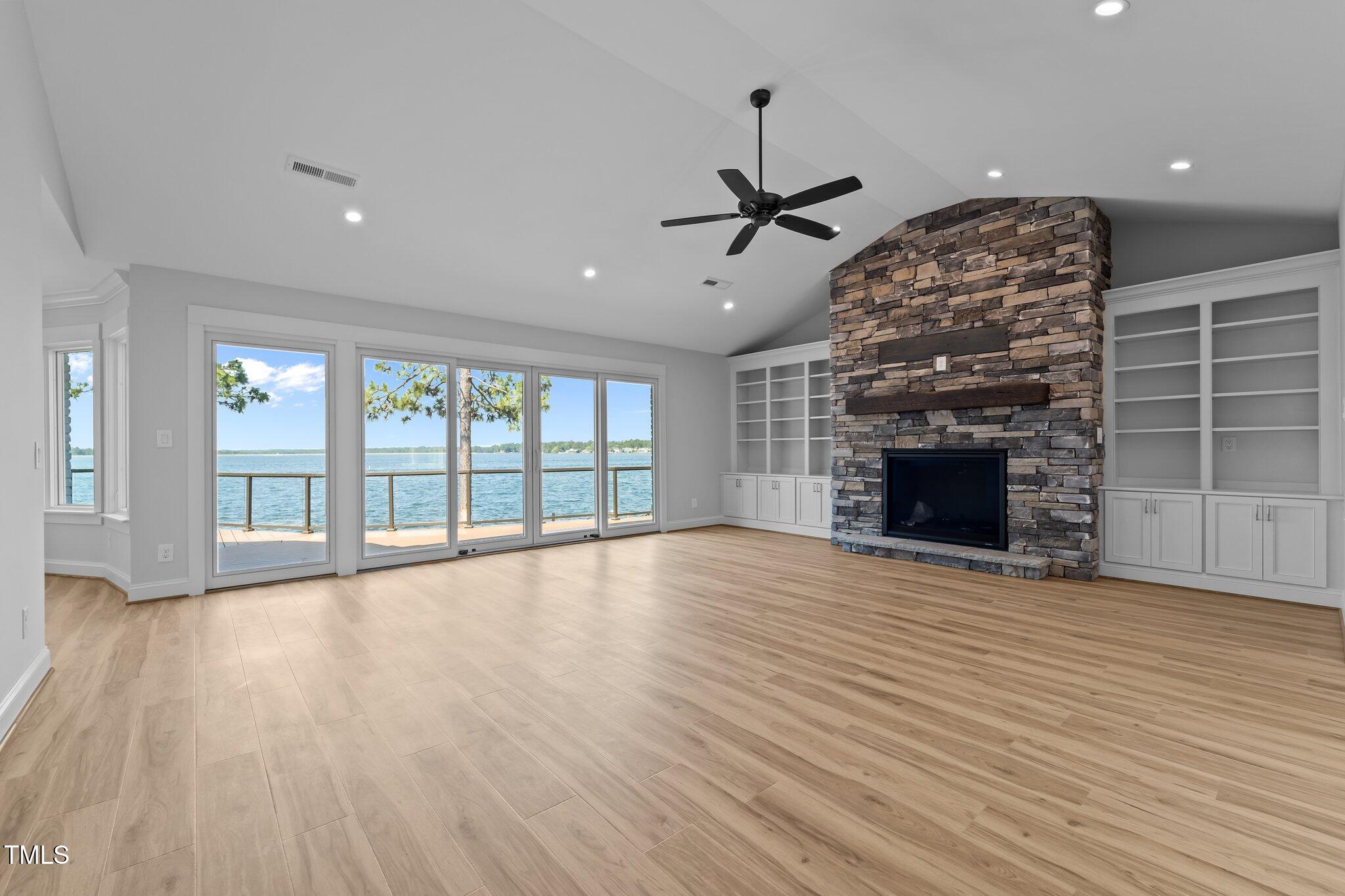 106 Mace Point West End, NC 27376 - Photo 35 of 79 a view of an empty room with wooden floor fireplace and a window
