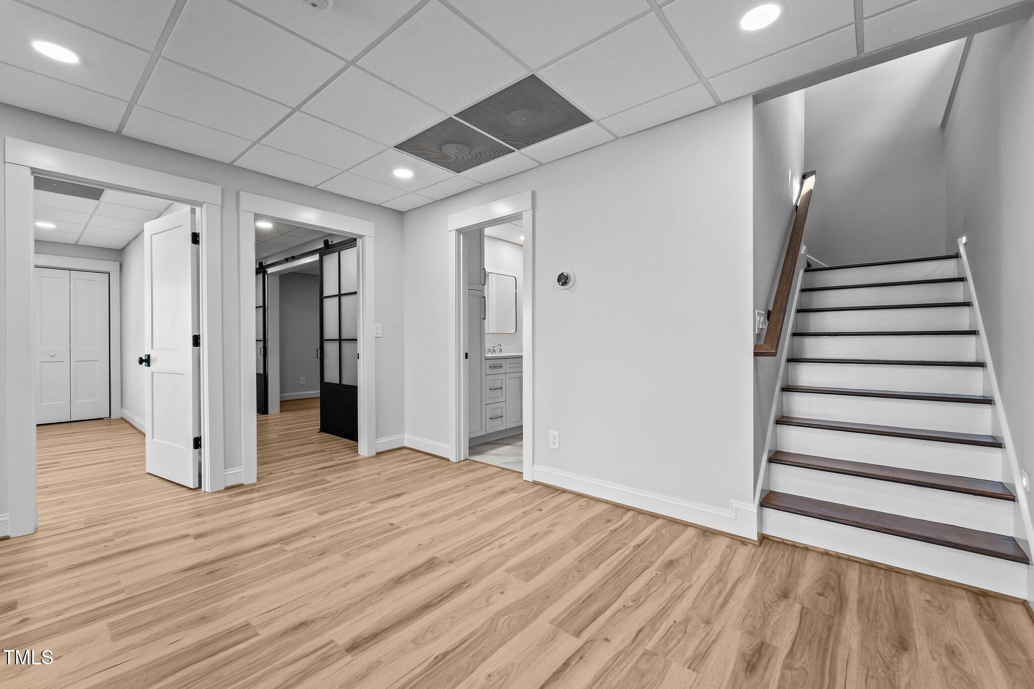 106 Mace Point West End, NC 27376 - Photo 39 of 79 a view of an empty room with wooden floor and stairs