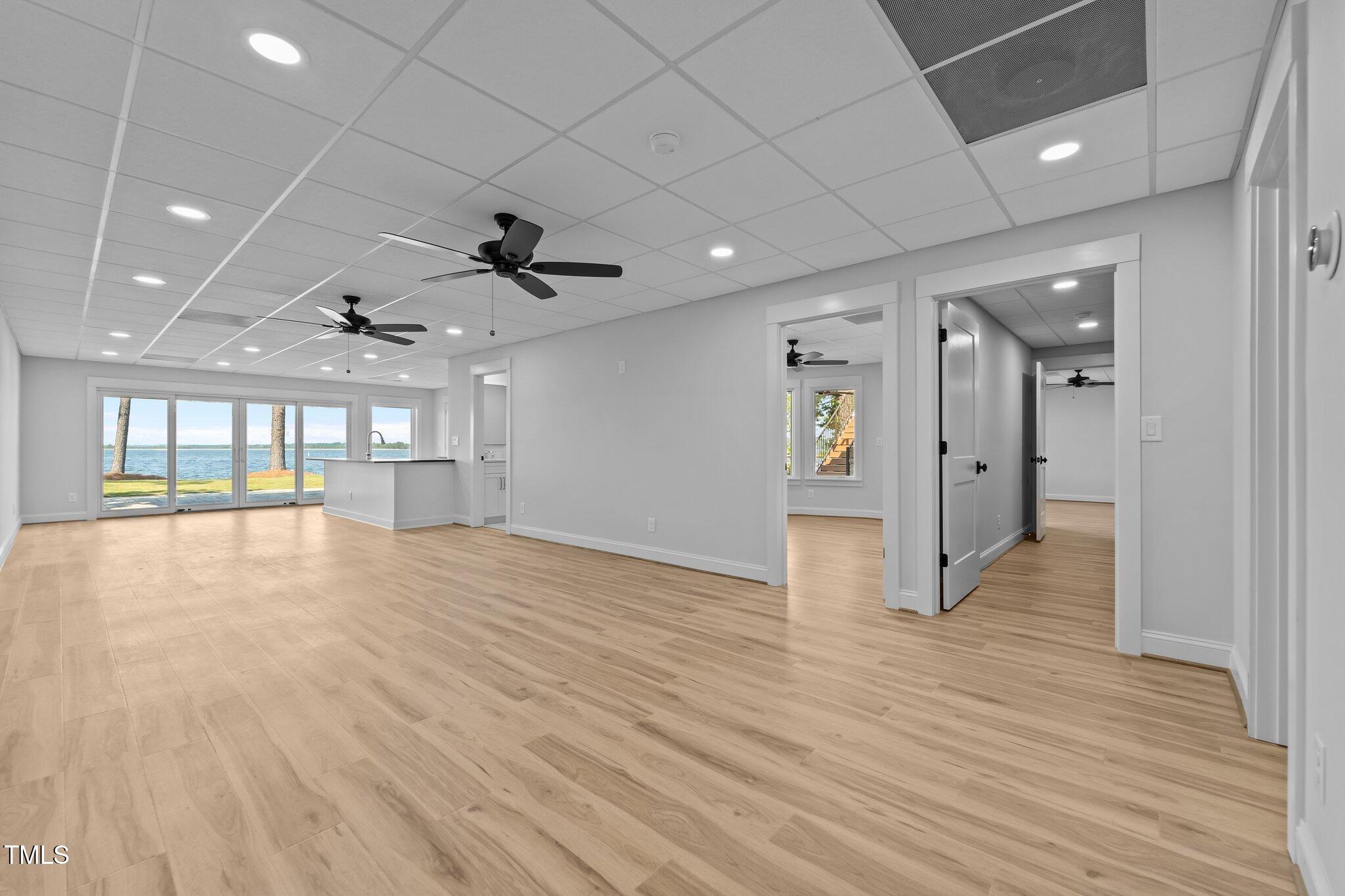 106 Mace Point West End, NC 27376 - Photo 40 of 79 a view of empty room with wooden floor and fan