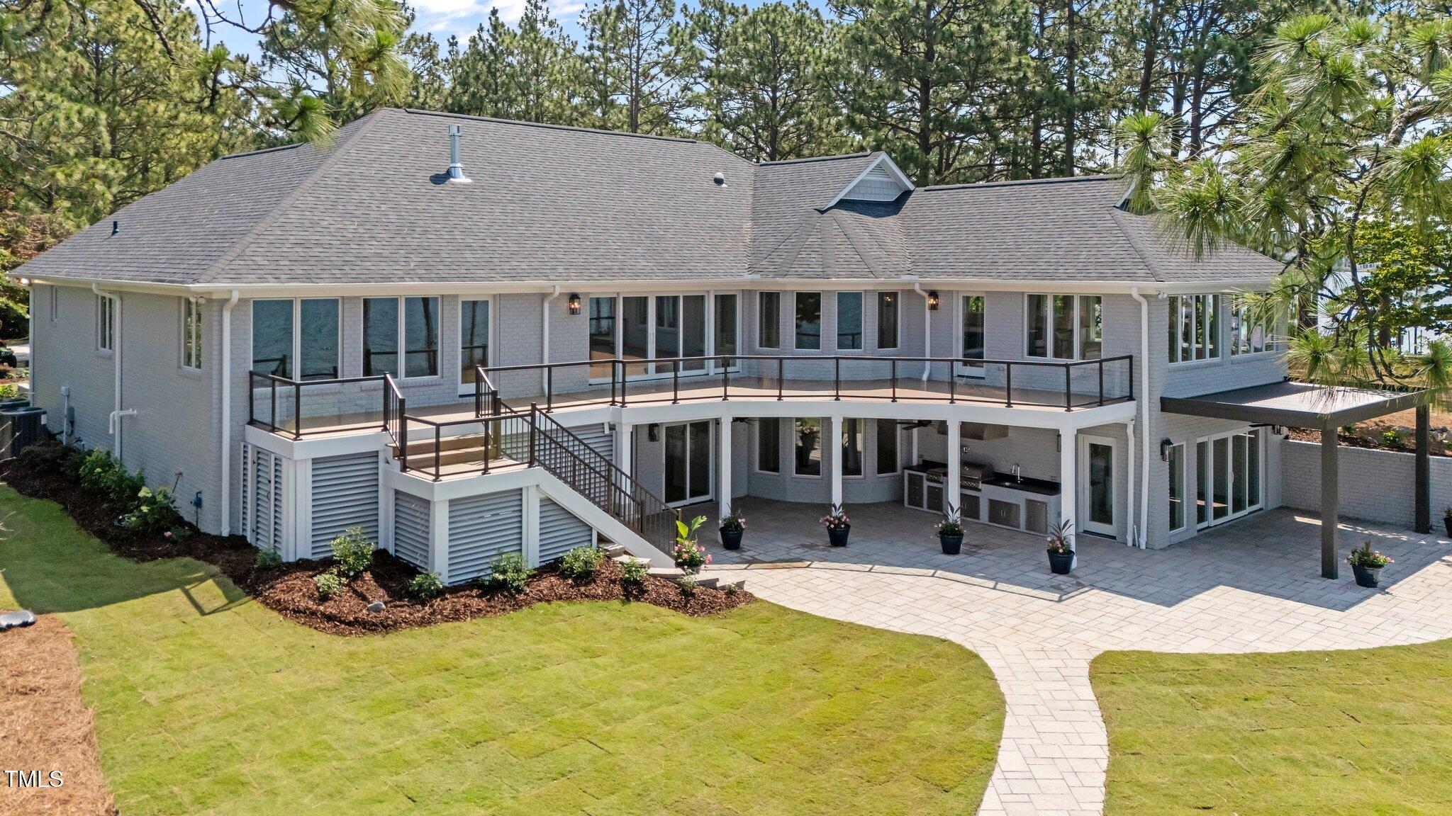 106 Mace Point West End, NC 27376 - Photo 3 of 79 a view of a house with yard and sitting area