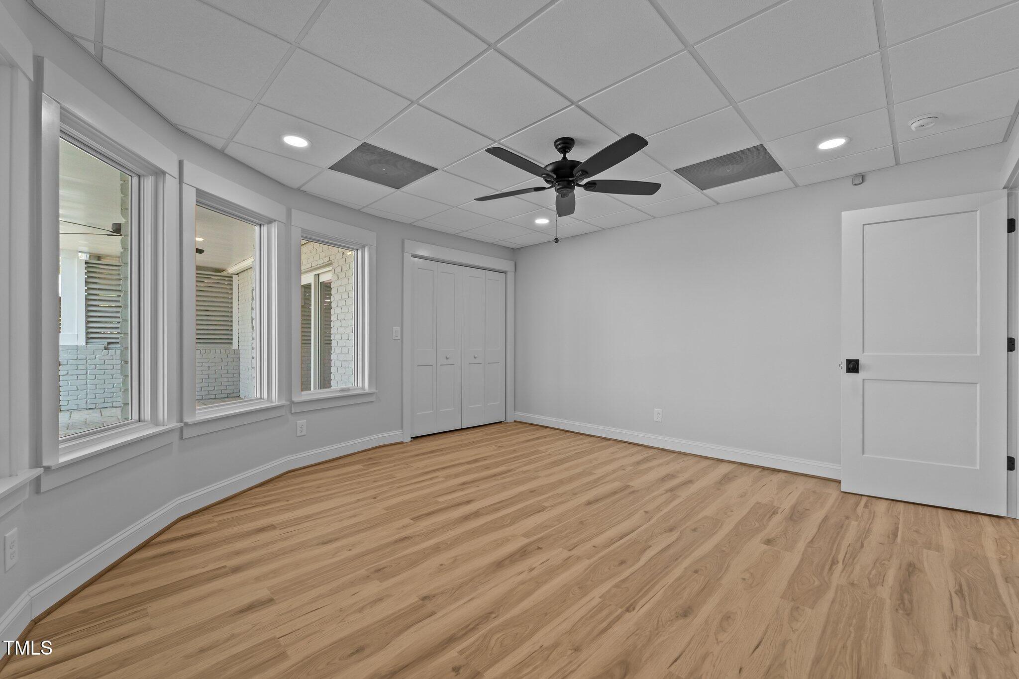 106 Mace Point West End, NC 27376 - Photo 50 of 79 a view of an empty room with a window and a chandelier fan