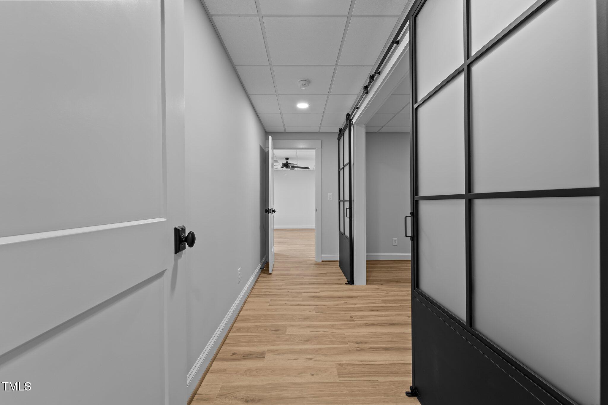 106 Mace Point West End, NC 27376 - Photo 51 of 79 a view of a hallway with wooden floor and staircase