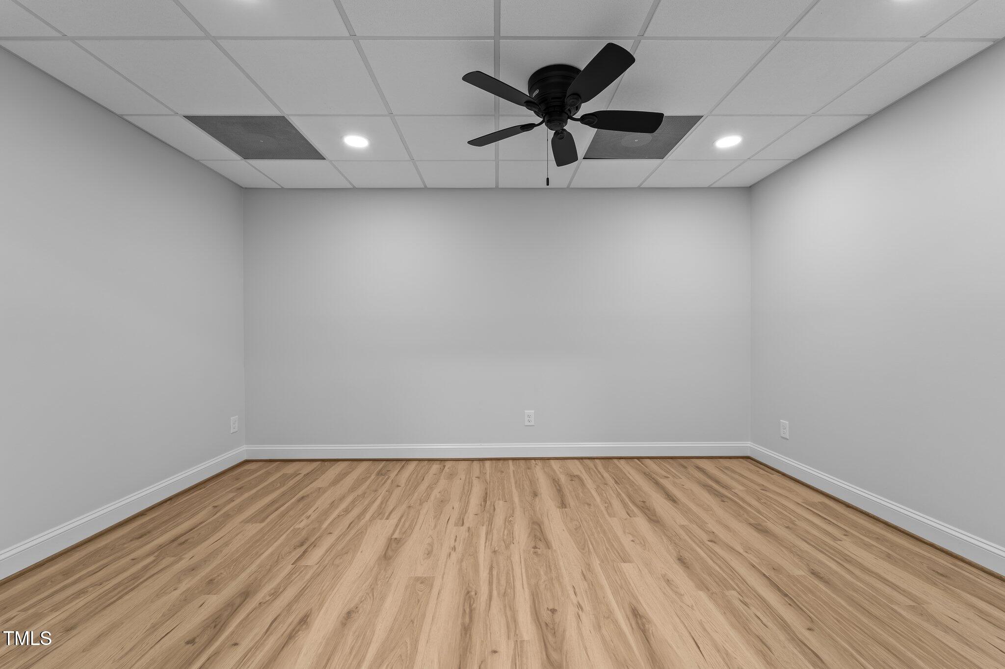 106 Mace Point West End, NC 27376 - Photo 52 of 79 an empty room with wooden floor and windows