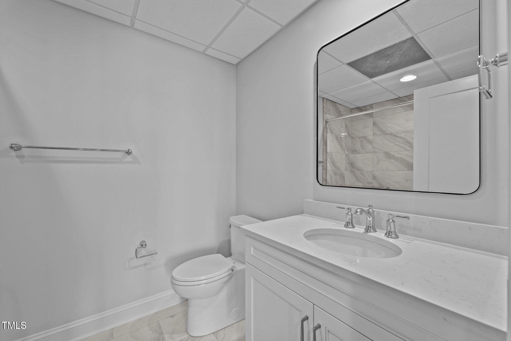 106 Mace Point West End, NC 27376 - Photo 56 of 79 a bathroom with a granite countertop sink a toilet and a mirror