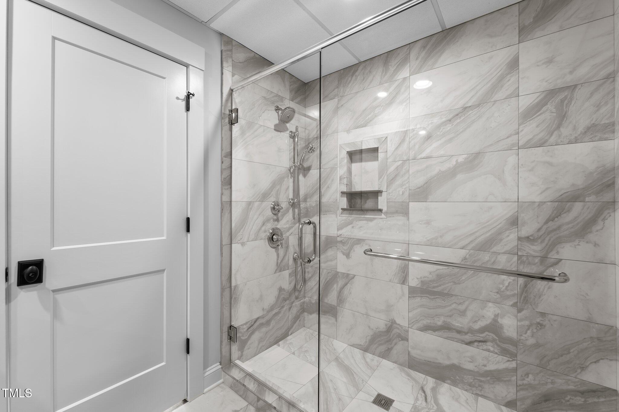 106 Mace Point West End, NC 27376 - Photo 57 of 79 a bathroom with a glass shower door