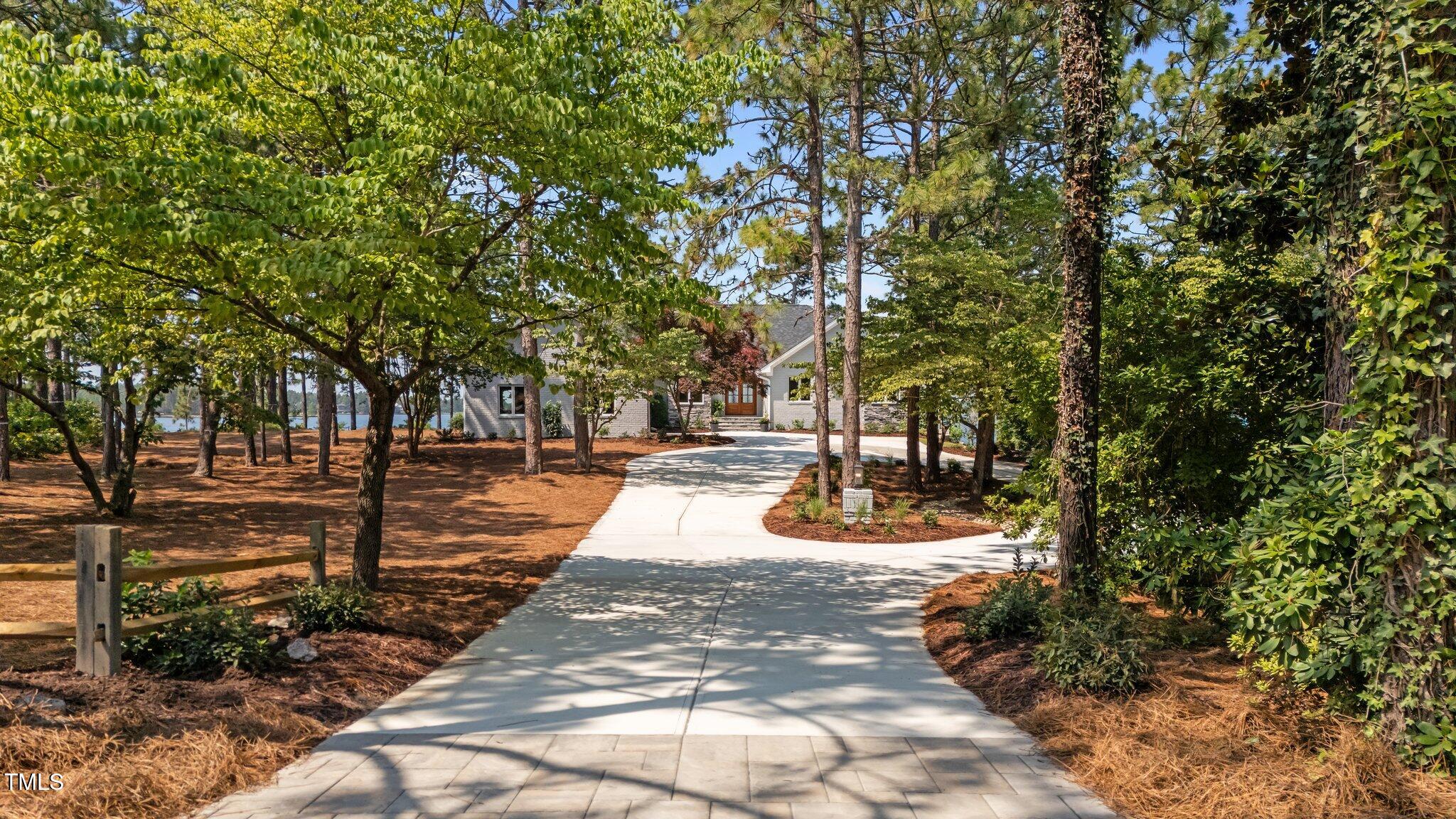 106 Mace Point West End, NC 27376 - Photo 4 of 79 a view of a yard with plants and trees