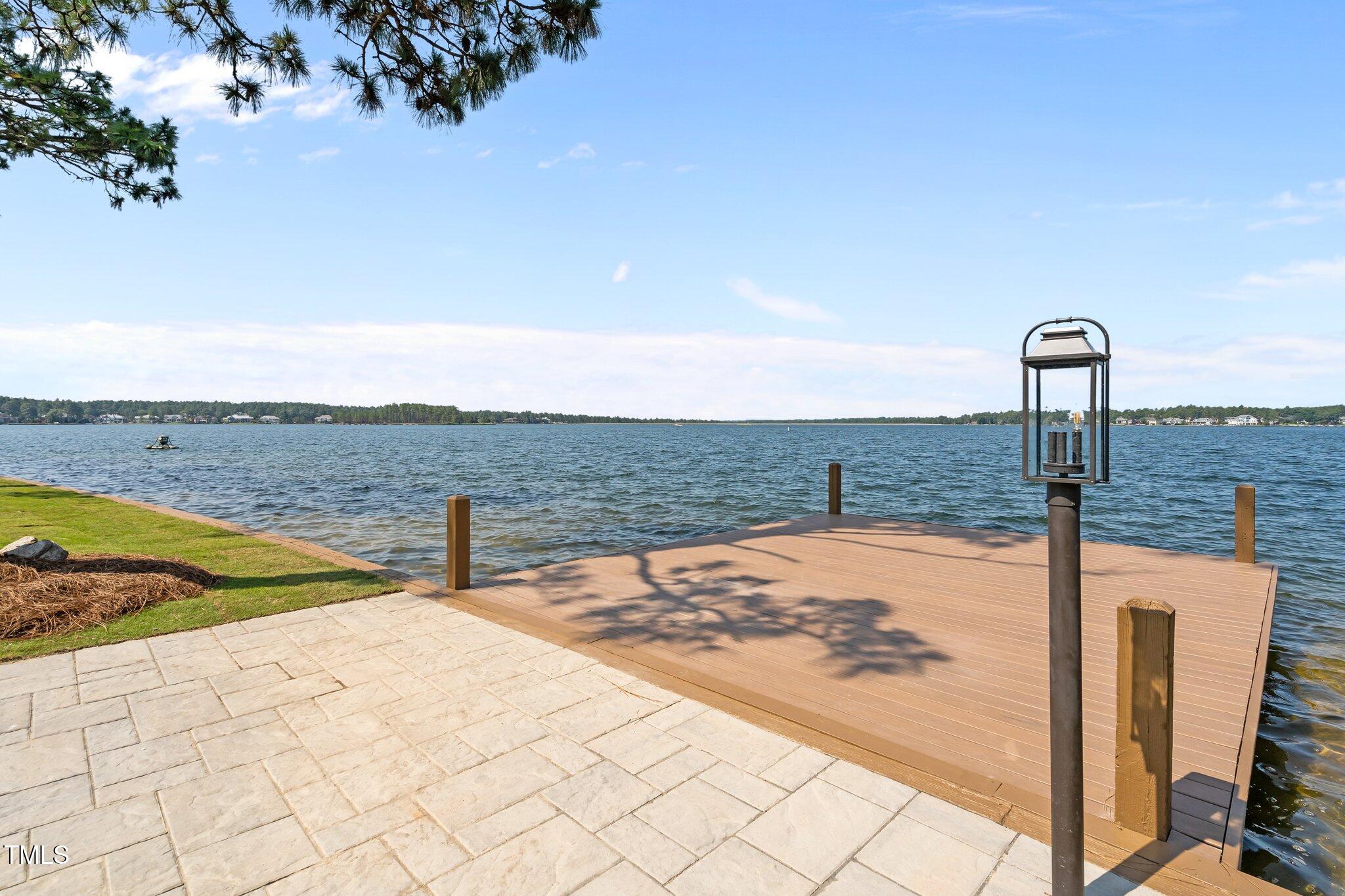 106 Mace Point West End, NC 27376 - Photo 70 of 79 a view of a swimming pool with a lounge chairs