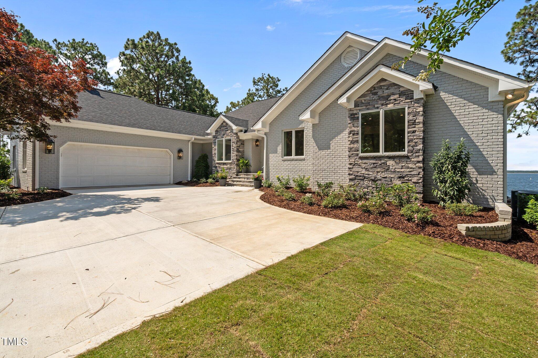 106 Mace Point West End, NC 27376 - Photo 73 of 79 a front view of a house with a yard