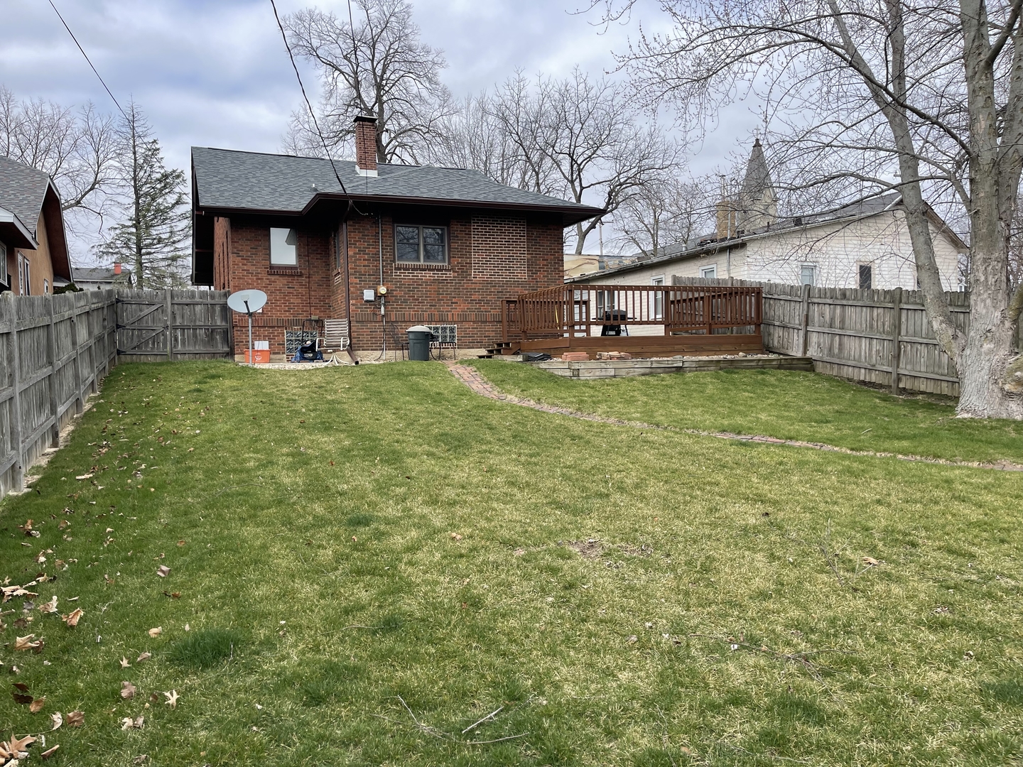 105 West 4th Street Spring Valley, IL 61362 - Photo 16 of 17 a backyard of a house with table and chairs