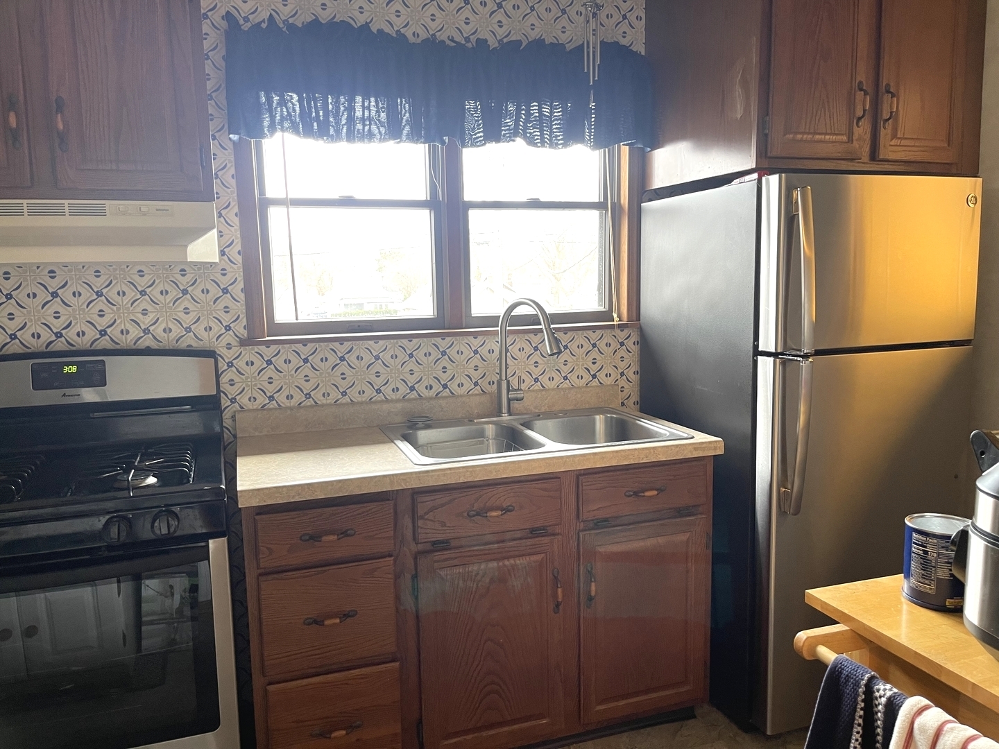 105 West 4th Street Spring Valley, IL 61362 - Photo 7 of 17 a kitchen with a sink a refrigerator and window