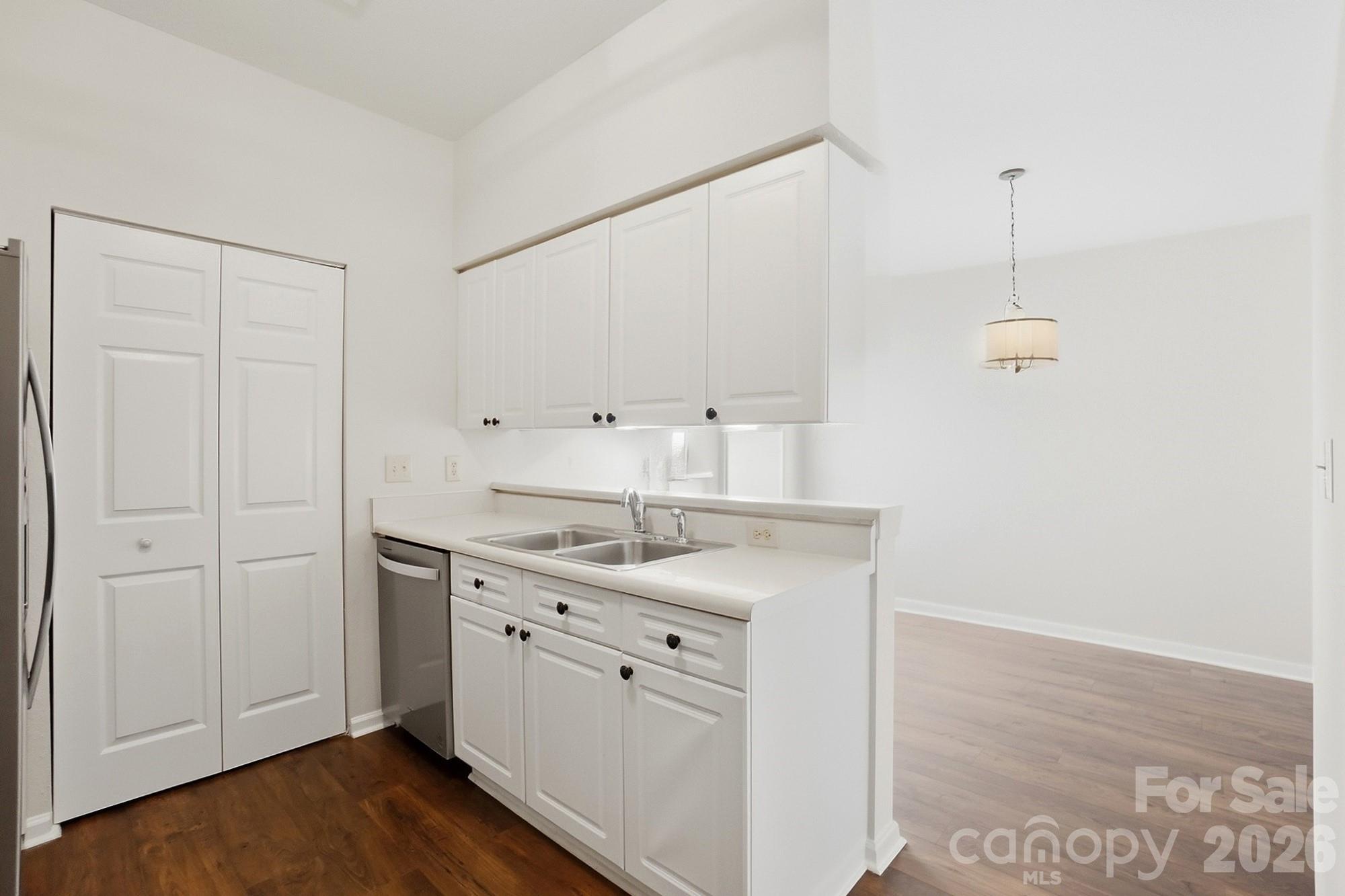 711 Stone Village Drive Fort Mill, SC 29708 - Photo 20 of 46 a kitchen with a sink cabinets and wooden floor